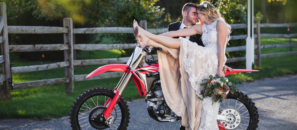 A bride and groom personalized their wedding by bringing their dirt bikes and using them in photos