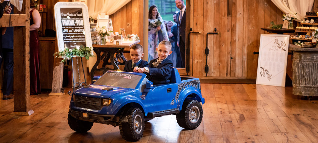 Two ring bearers entering the wedding reception. This is for the article called best ring bearer entrance songs