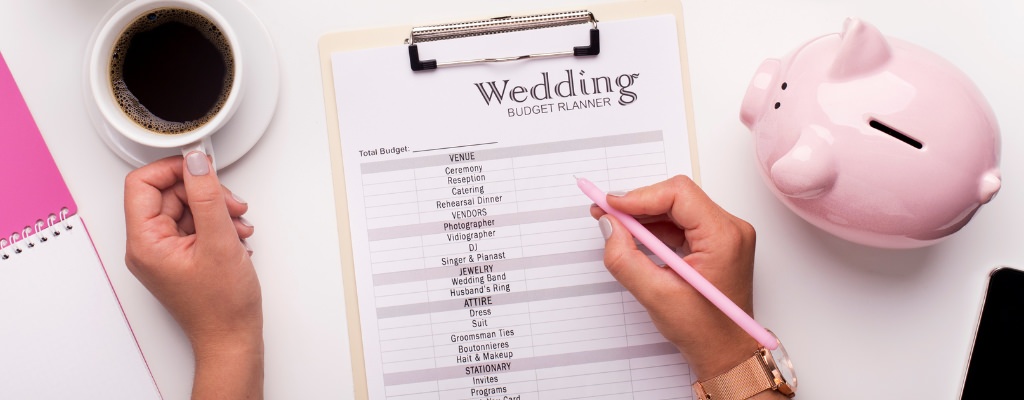 A bride filling out a budget worksheet for her wedding