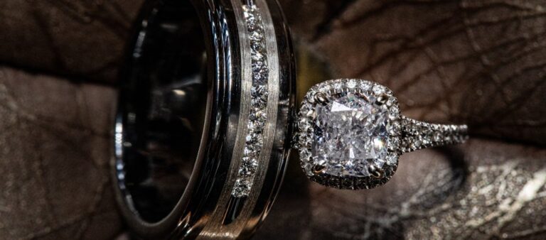 A close up photo of a wedding band and wedding ring