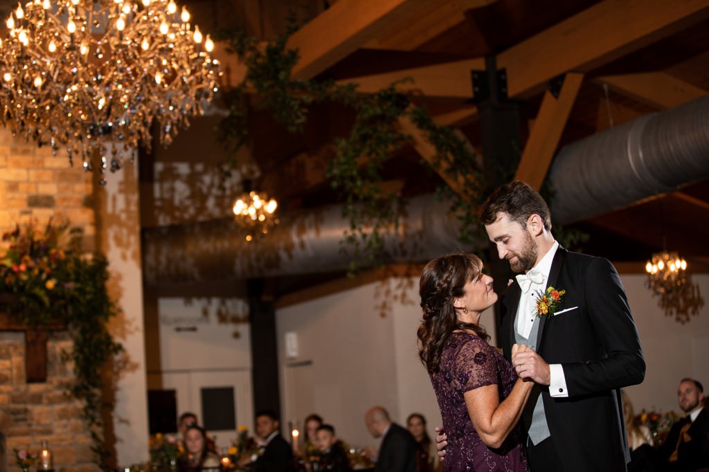 A mom dancing with her son at his wedding