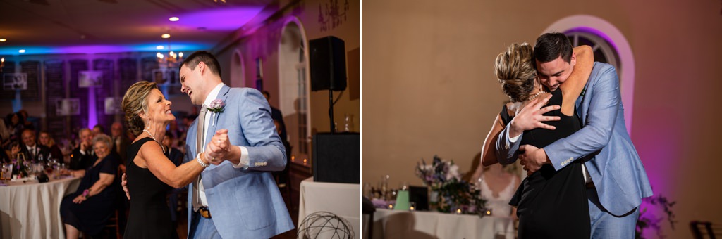 A mom smiling at her son as they dance together at this wedding