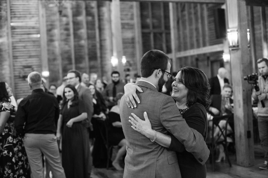 A mom dancing with her son at his wedding