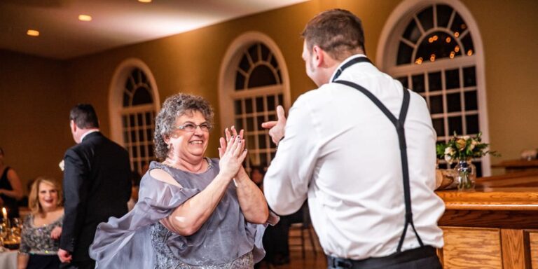 A mom and her son dancing at a wedding reception. This is for the article called mother son wedding dances