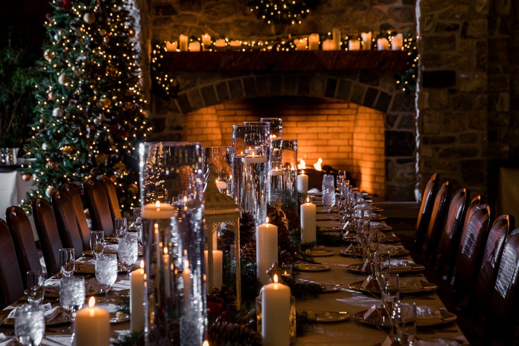 A winter wedding that used hurricane vases with floating candles instead of centerpieces with flowers.