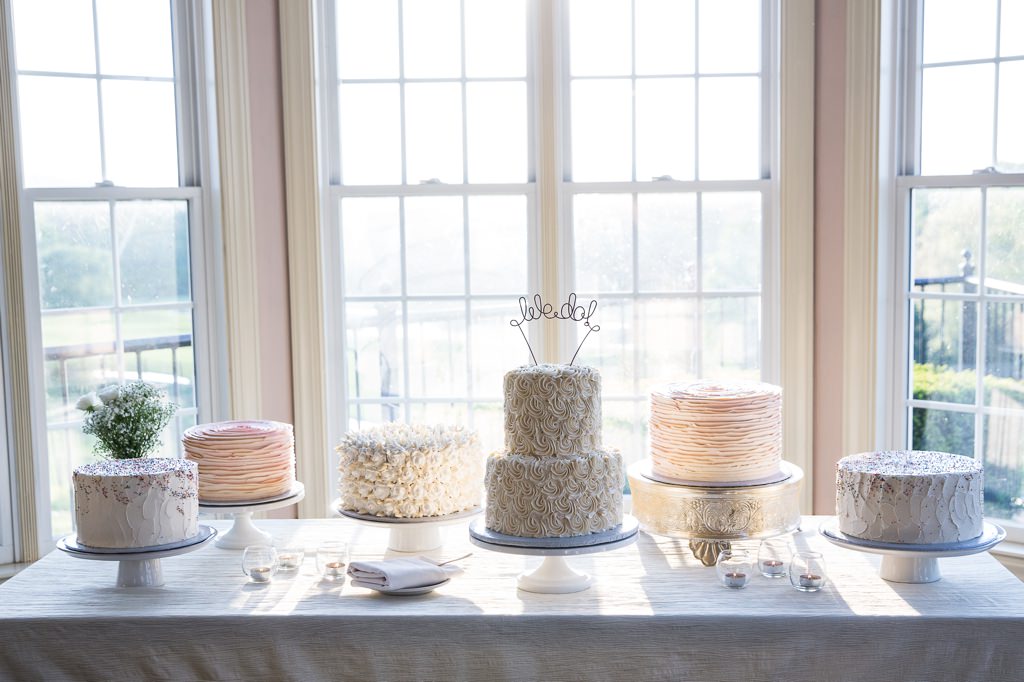 A variety of wedding cakes on a table