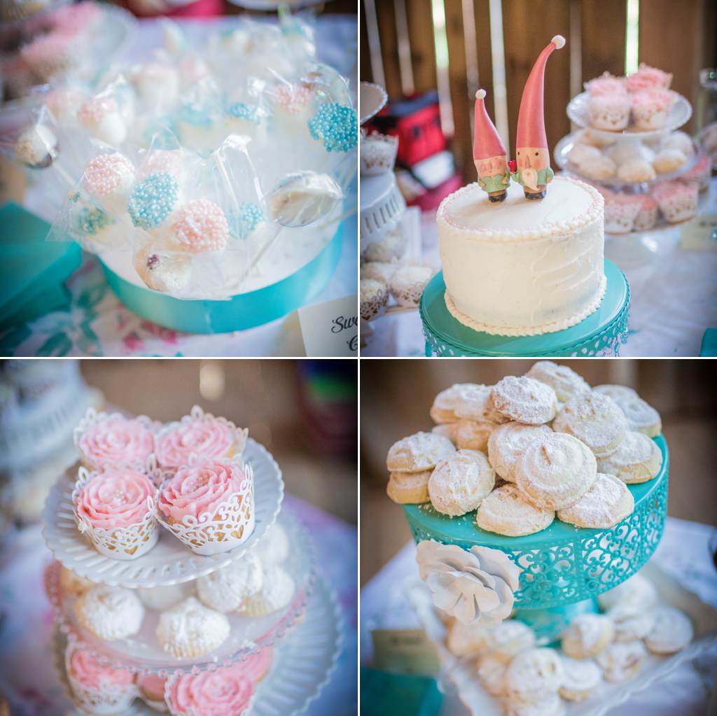 Pink and blue wedding desserts with cute gnome figurines on the cake