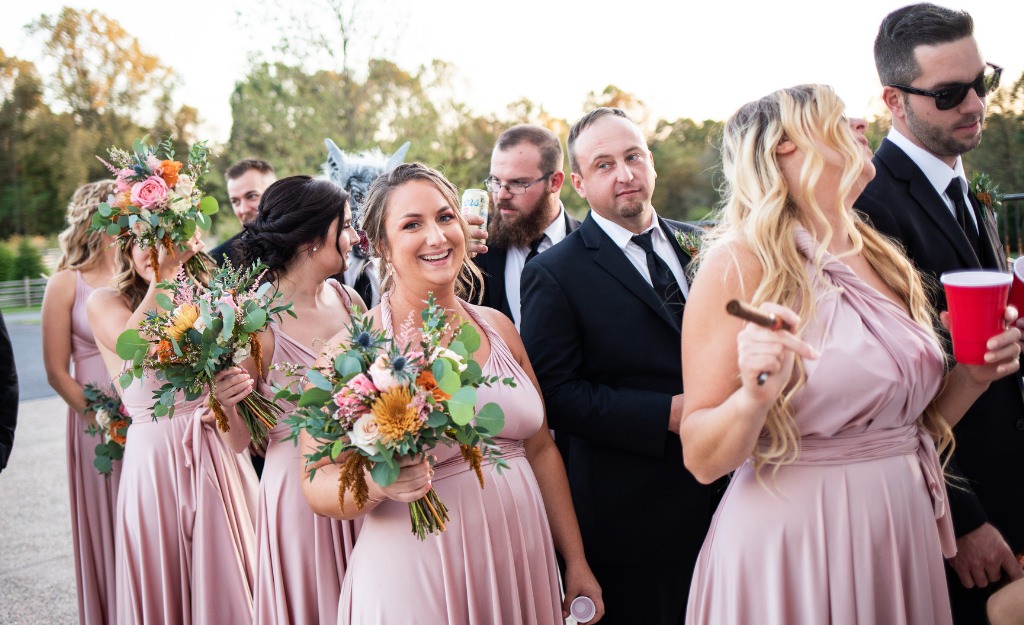 The wedding party lined up outside the reception getting ready for introductions