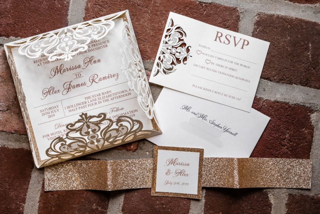 A beautiful gold lace wedding invitation