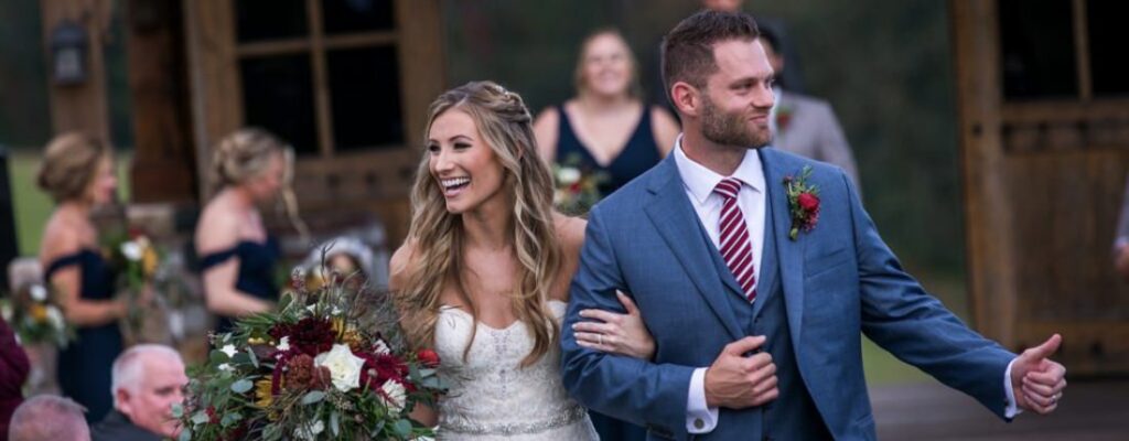 A bride and groom walking down the aisle after getting married