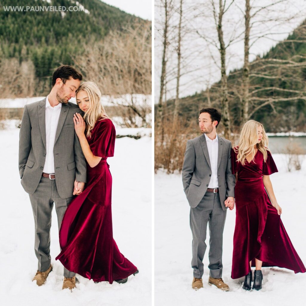 A couple posing for engagement pictures in the snow. The girl is wearing a long red dress
