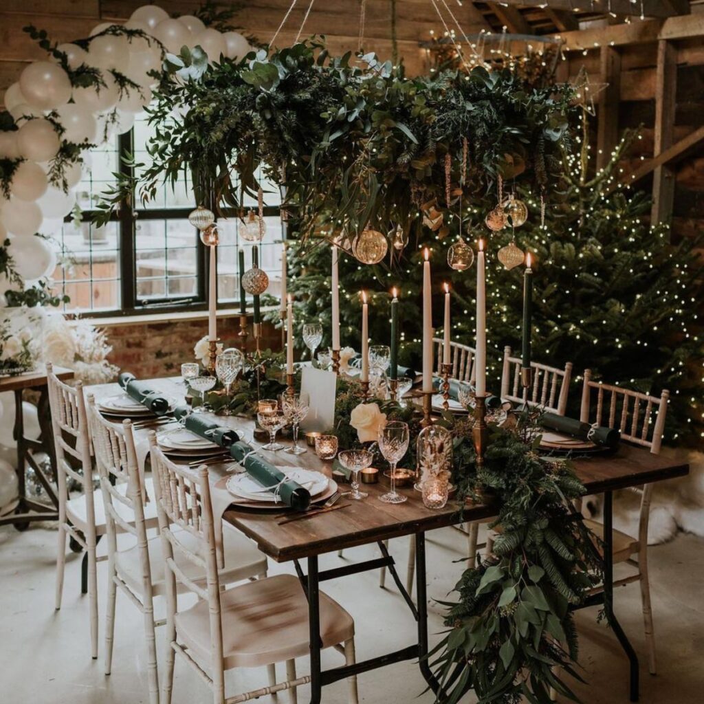 A stunning tall Christmas wedding centerpiece at a wedding reception