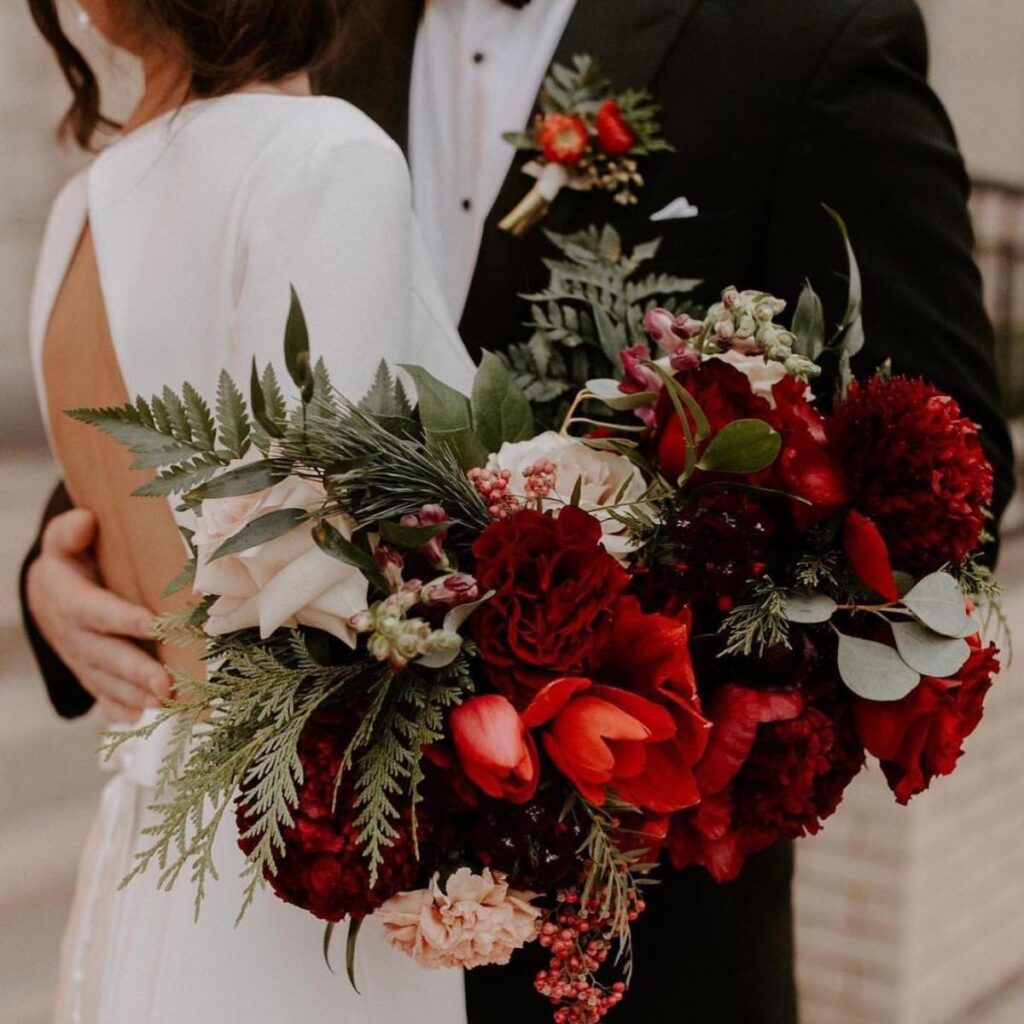 A beautiful wedding bouquet with dark red flowers
