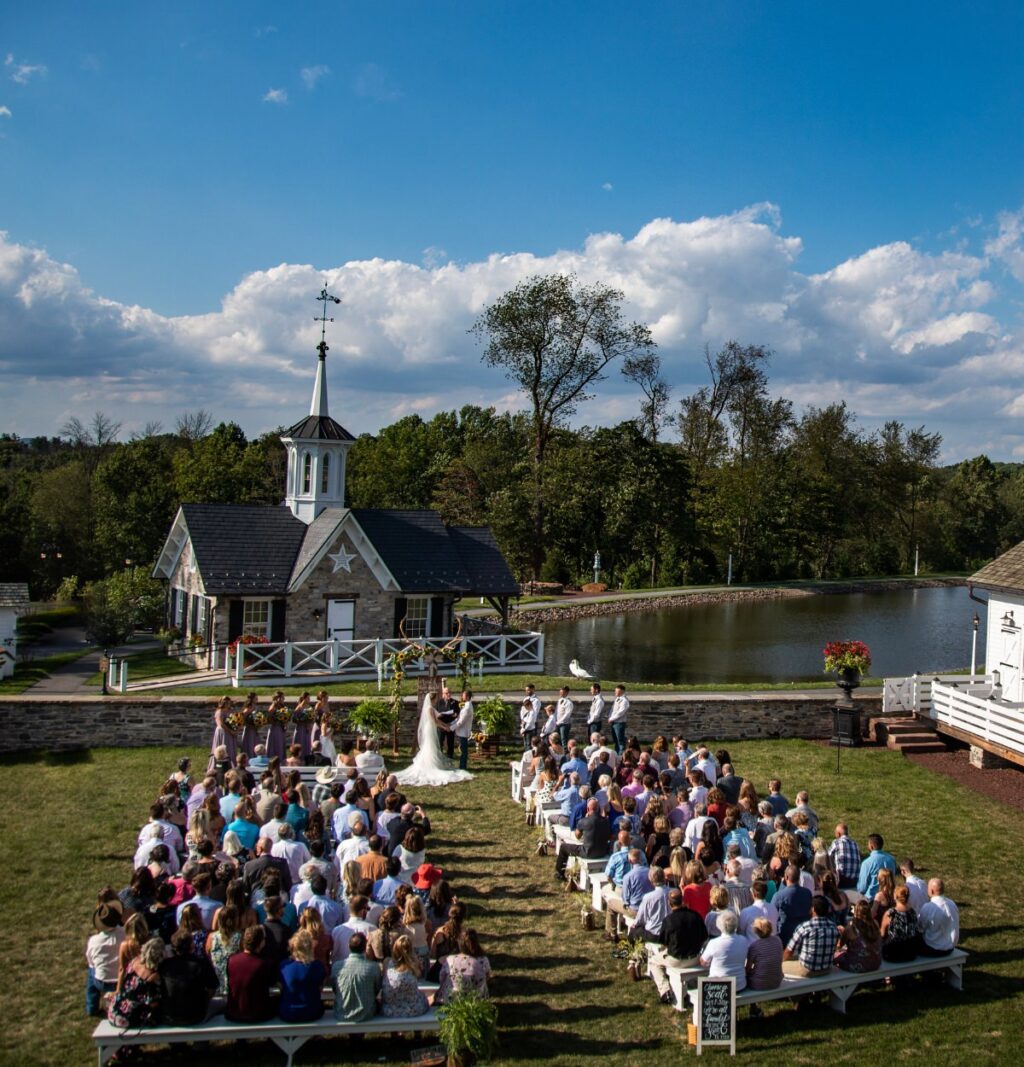 An outside wedding ceremony taking place.