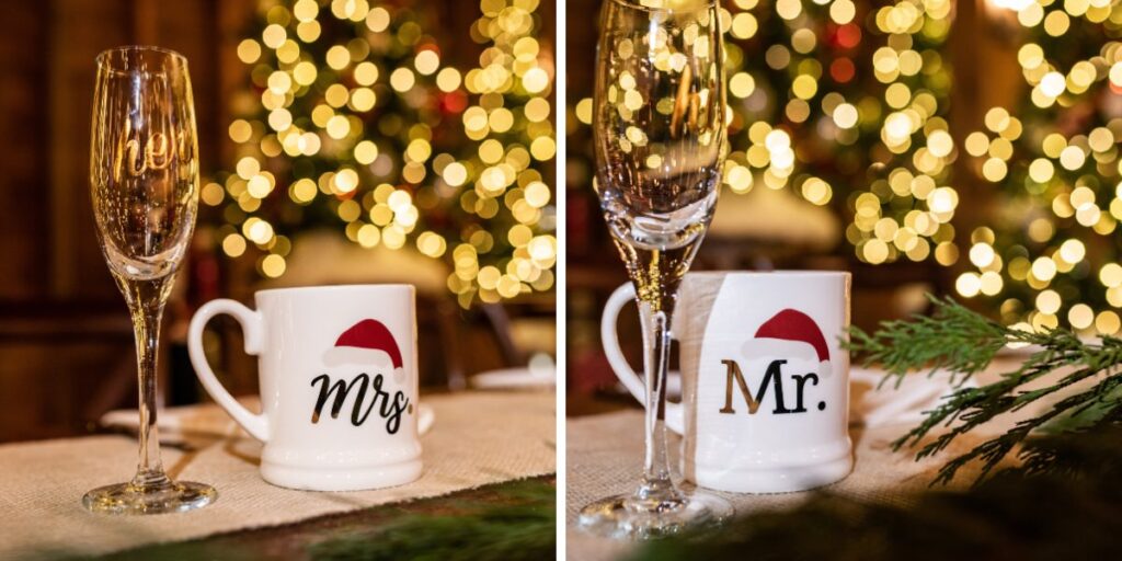 Mr. and Mrs. Santa mugs sitting on a sweetheart table at a Christmas-themed wedding reception