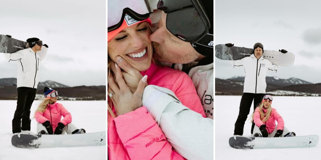 A couple taking winter engagement photos in their snowboarding gear. they are also holding their snowboards.