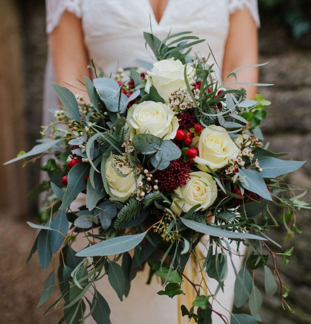 A closeup of a Christmas winter themed bridal bouquet