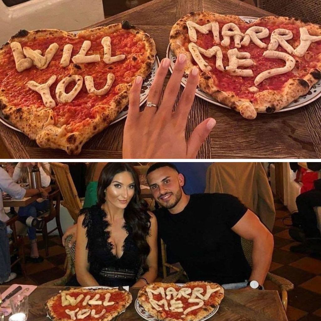 A couple posing with will you marry me pizzas and showing off the engagement rings