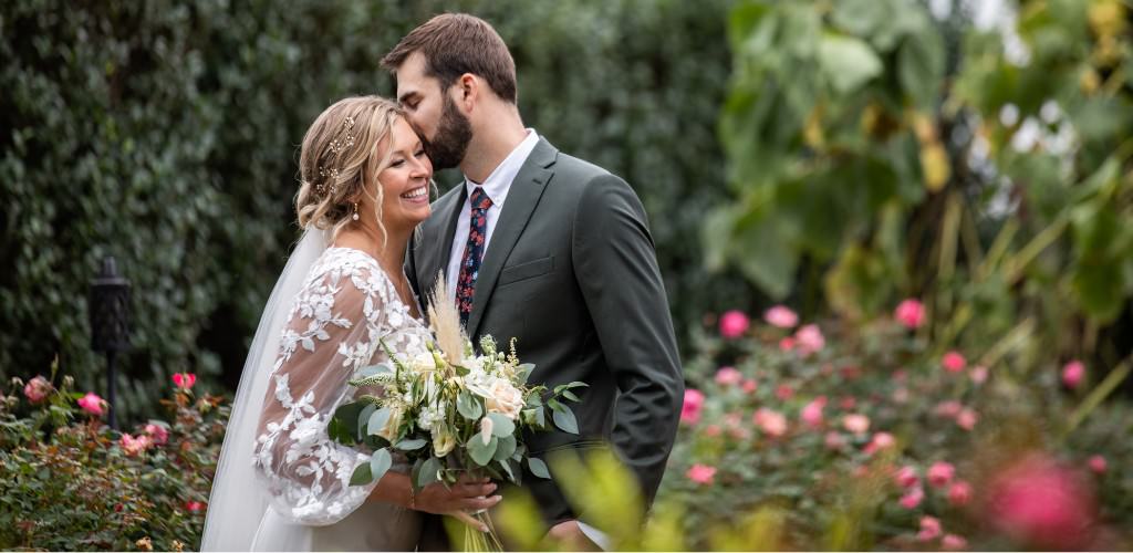 A bride and groom smiling