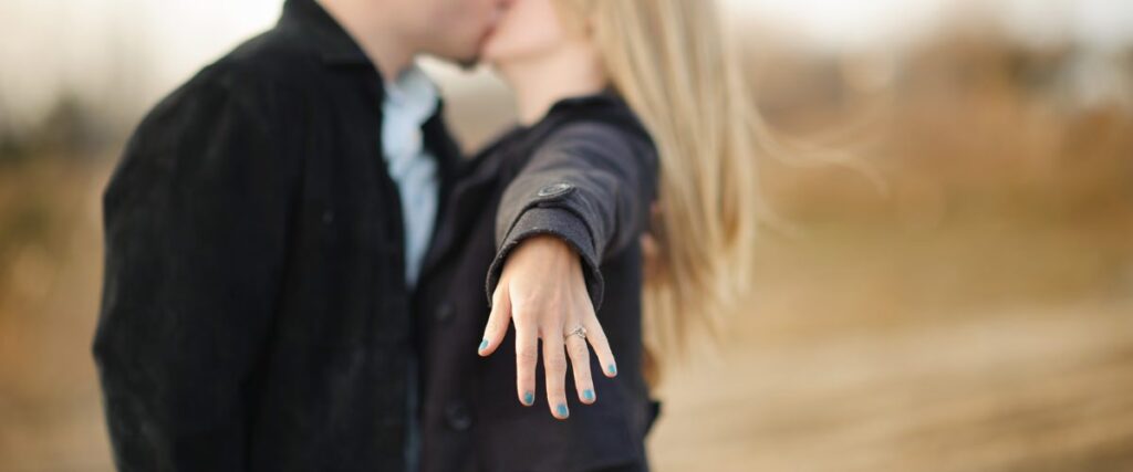 A close up of a hand with an engagement ring on it. This was taken during an engagement session