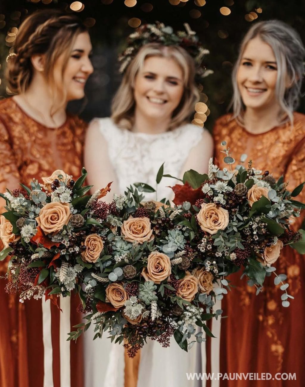 Beautiful bridesmaid bouquets and a bridal bouquet with a rust and burnt orange rustic palette