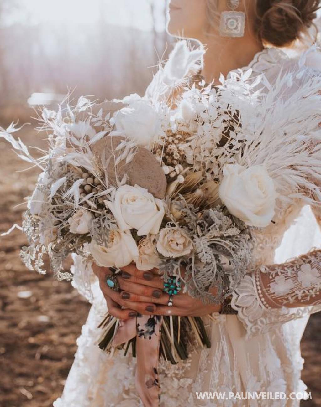 A white and beige rustic bridal bouquet for the bride