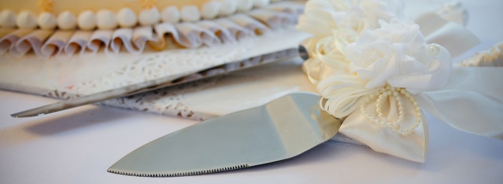 A wedding cake knife and server set