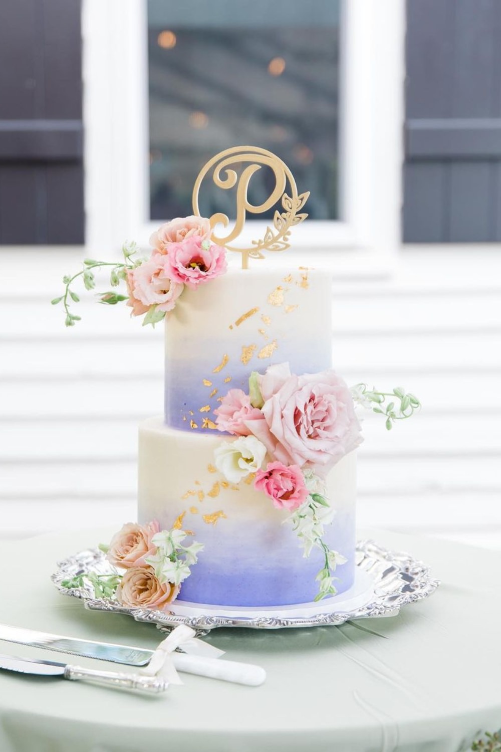 A white and lavender purple two tier wedding cake