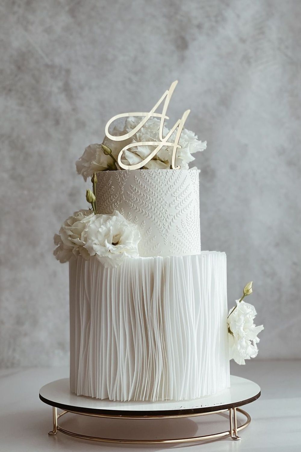 A modern chic wedding cake design with 2 tiers