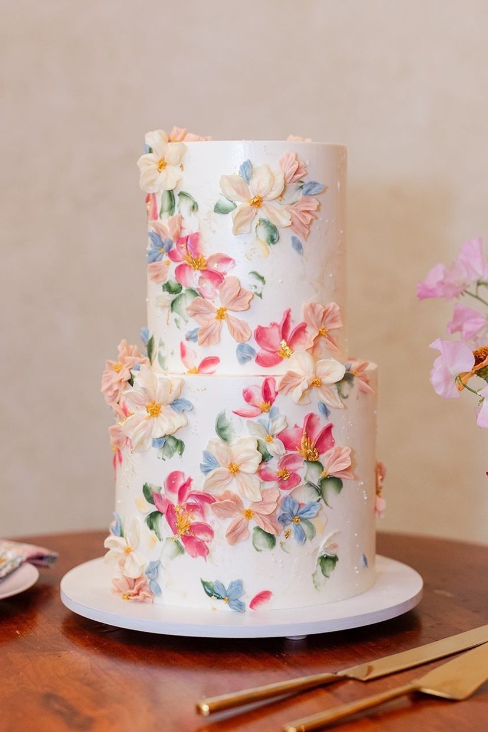 A stunning 2-tier wedding cake with wildflower design