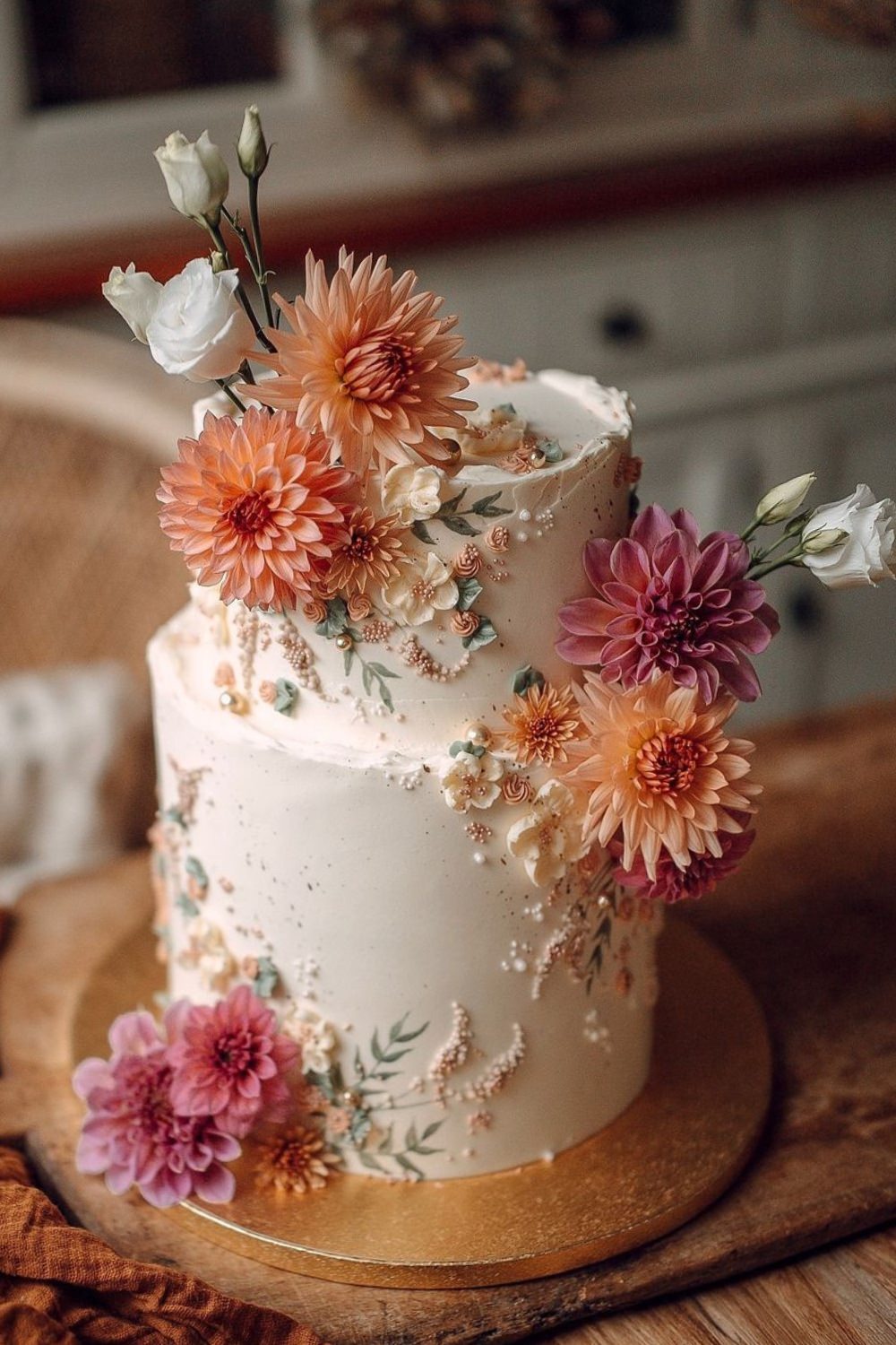 A beautiful two tier wedding cake design with real flowers