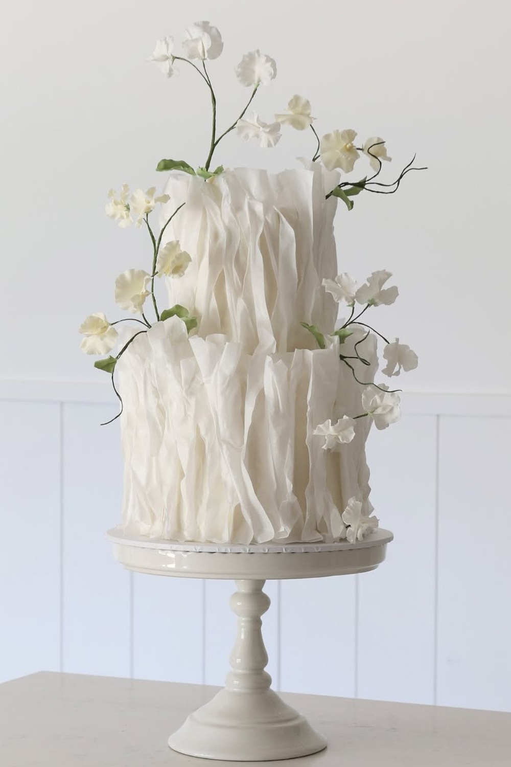A 2-tier white wedding cake