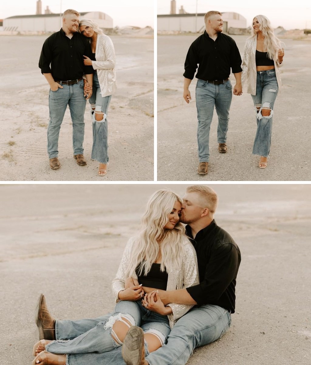 A couple posing in jeans and black shirts. She also has a cream colored over-shirt