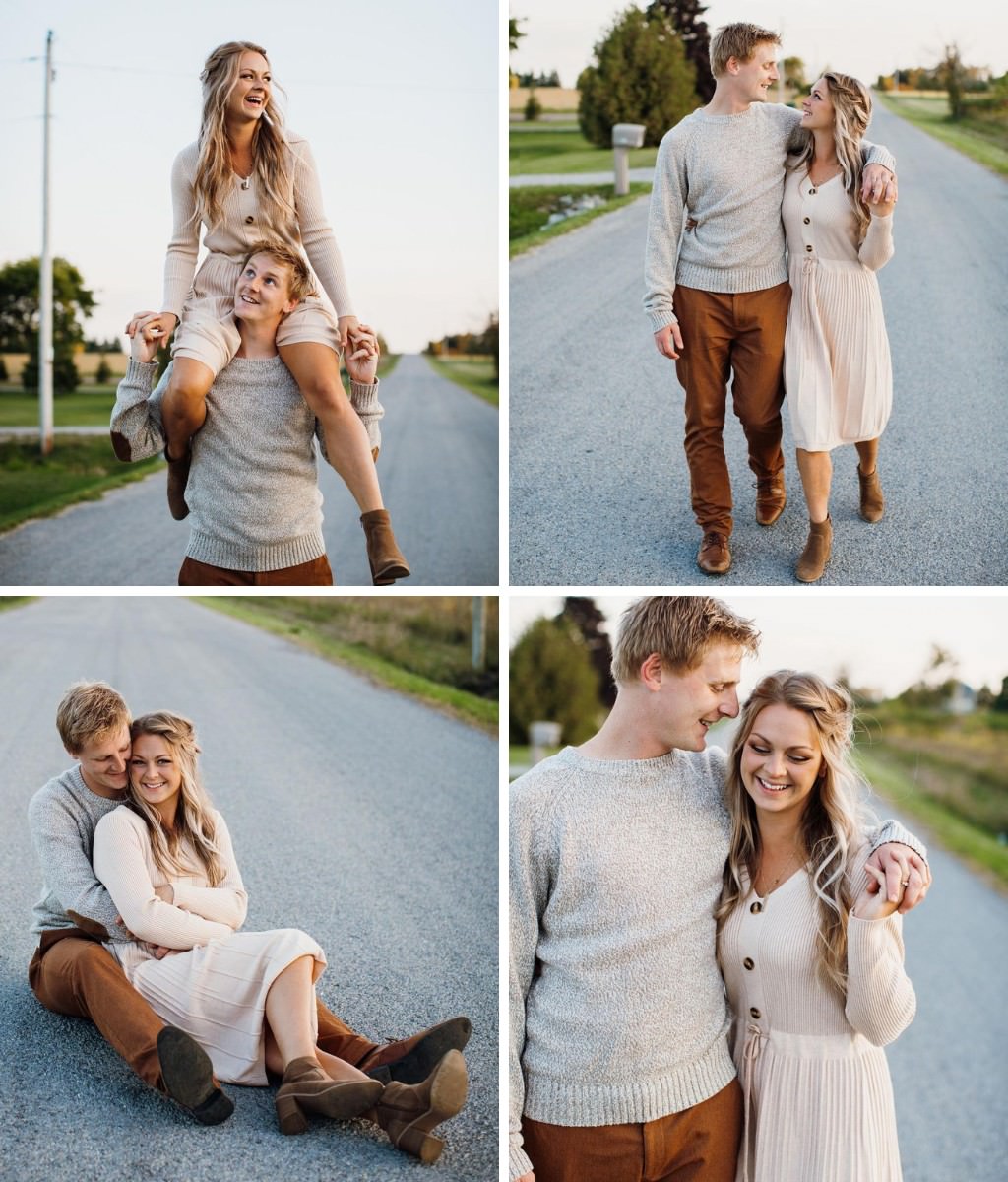 A couple posing for engagement photos in fall fashion