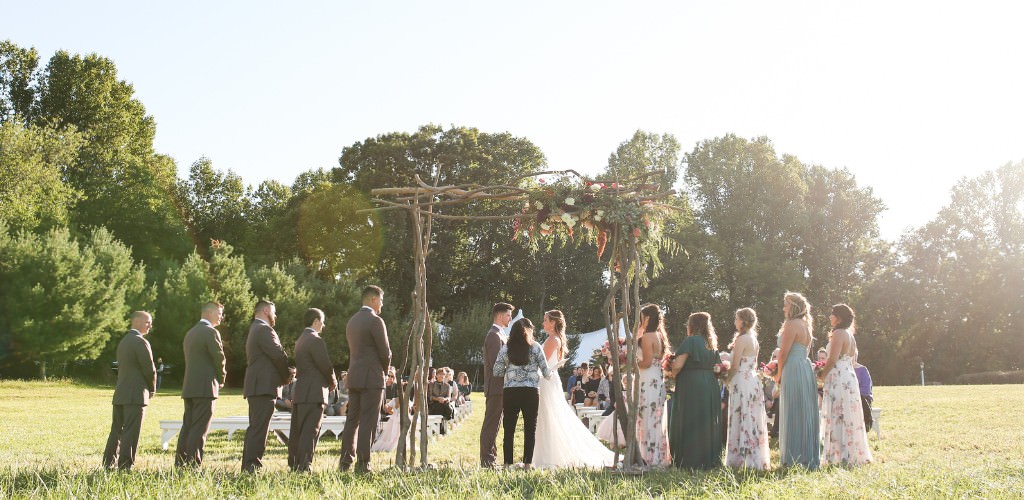 A bride and groom getting married in the backyard of a family member.