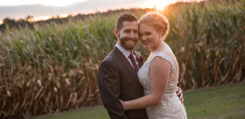 A bride and groom posing at sunset. This is for the blog post called how to plan a wedding for $3,000