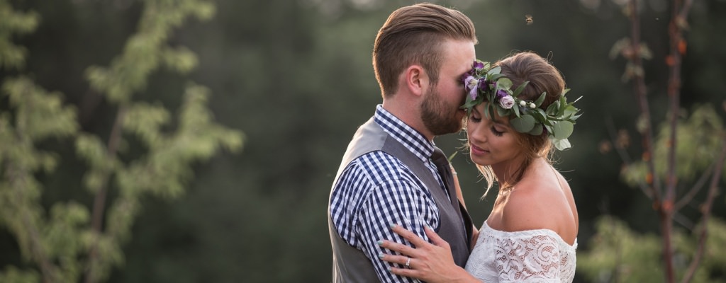 A groom kissing the bride on the cheek. This is for the blog post called how to plan a wedding in 6 months or less