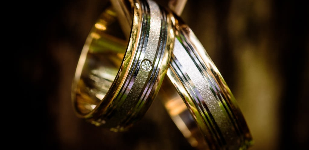 Two wedding bands with dramatic light on them