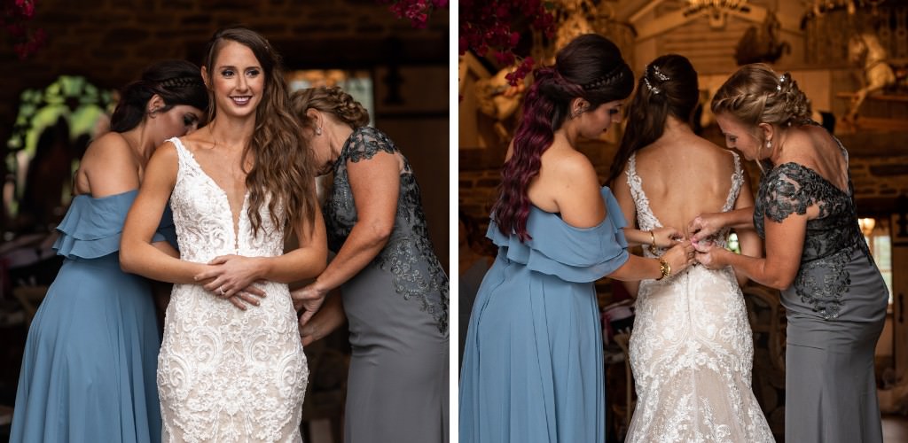 A bride getting her dress buttoned by the maid of honor and her mom