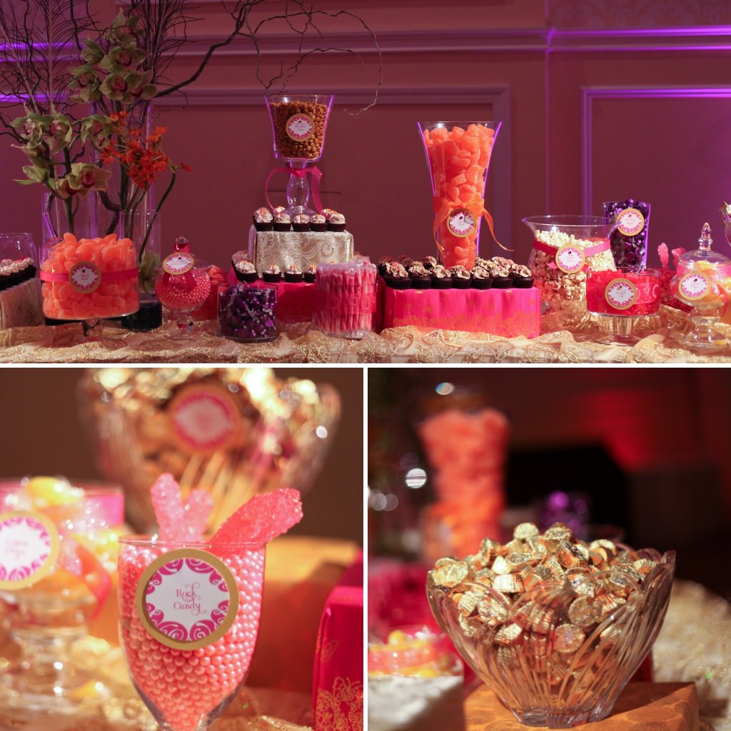 A gold and pink wedding candy table