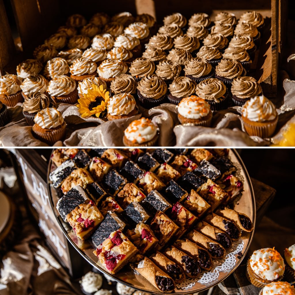 Cannolis and cupcakes displayed on a wedding dessert table