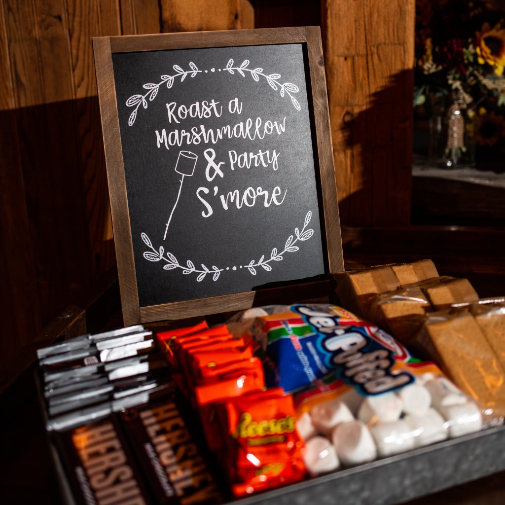 A wedding dessert table with s'mores