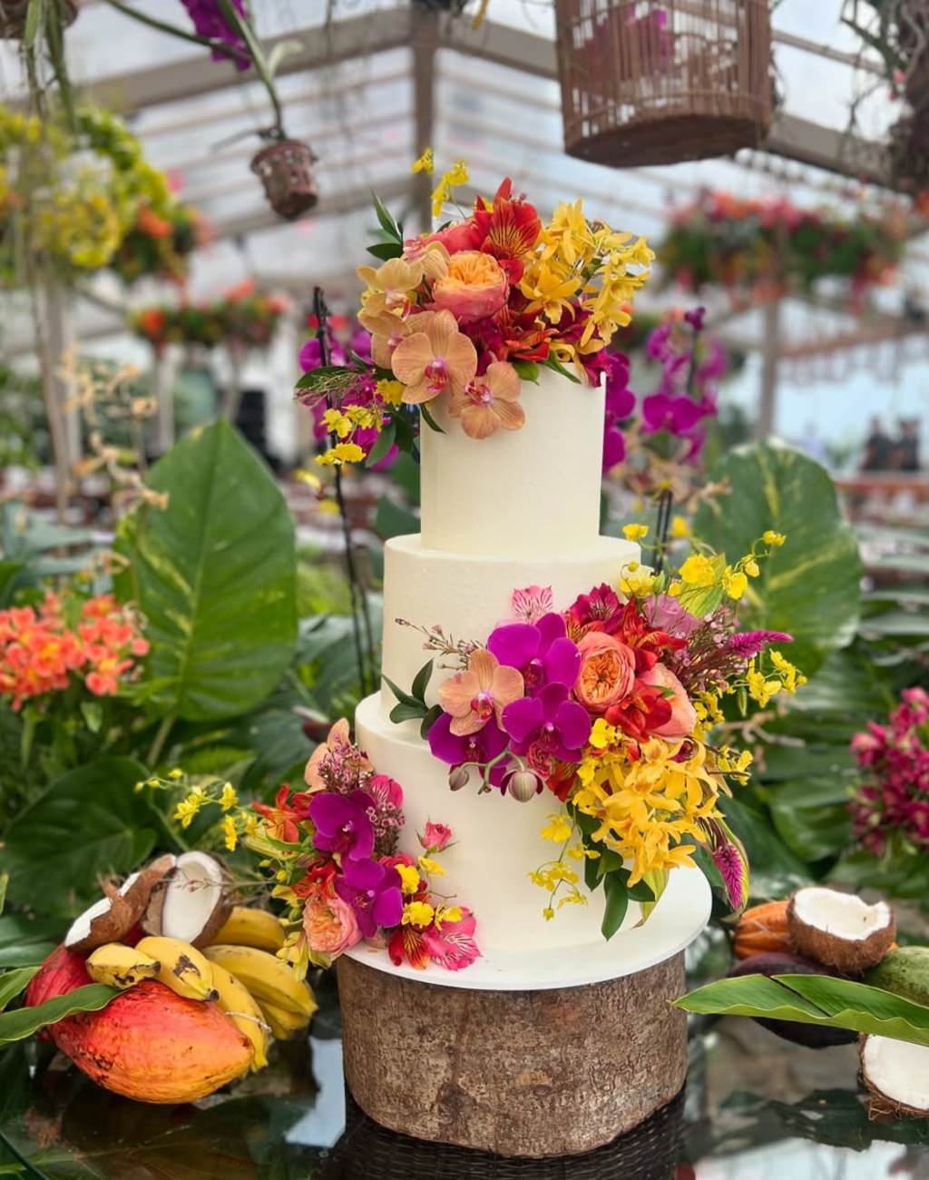 A 3-tier wedding cake with tropical theme