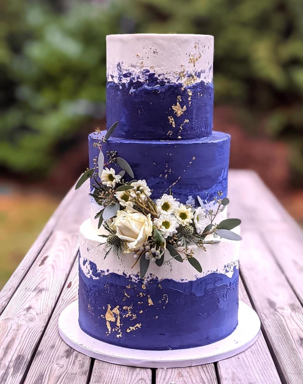 A 3-tier purple and lavender wedding cake