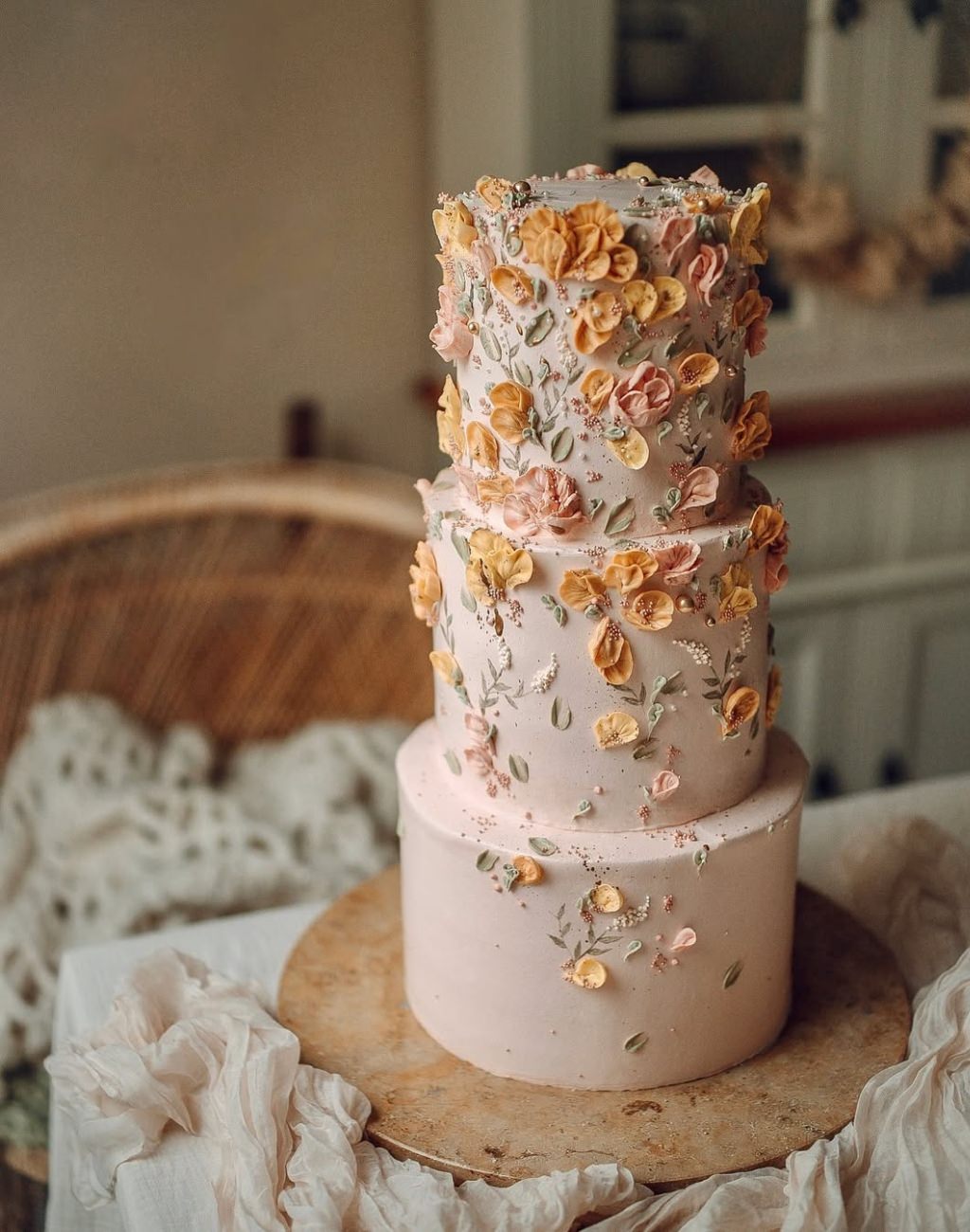 A gorgeous 3-tier wedding cake with blush pink fondant or frosting