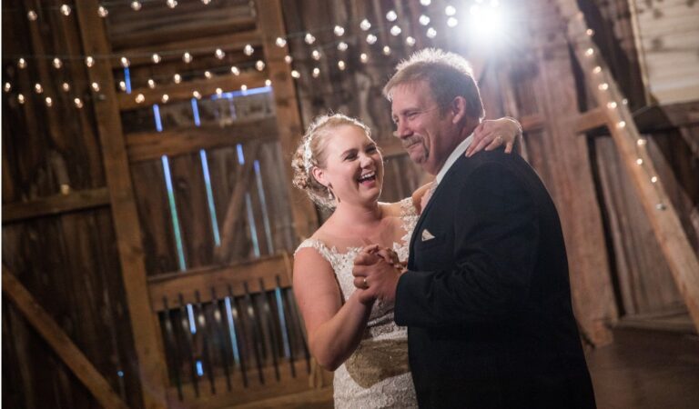 A stepdad dancing with the bride at a wedding reception. This is for the post called step-father and daughter dance songs for a wedding.