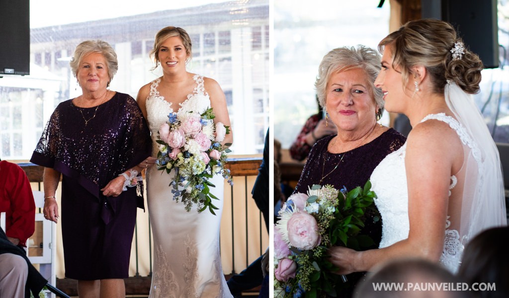 A bride walking with her mom down the aisle at the wedding ceremony