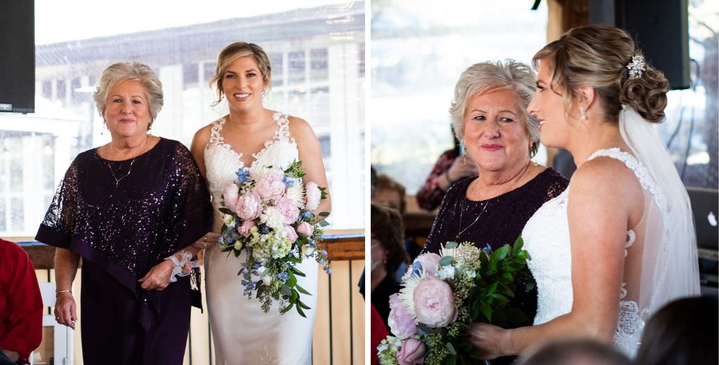 A bride walking her daughter down the aisle at a wedding ceremony and looking sweetly at her