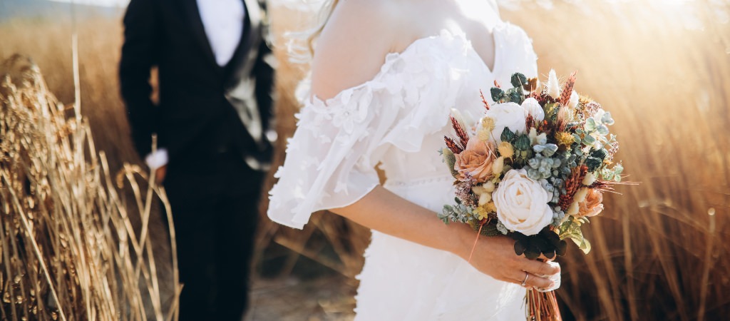 A close up photo of a bride's bouquet at sunset