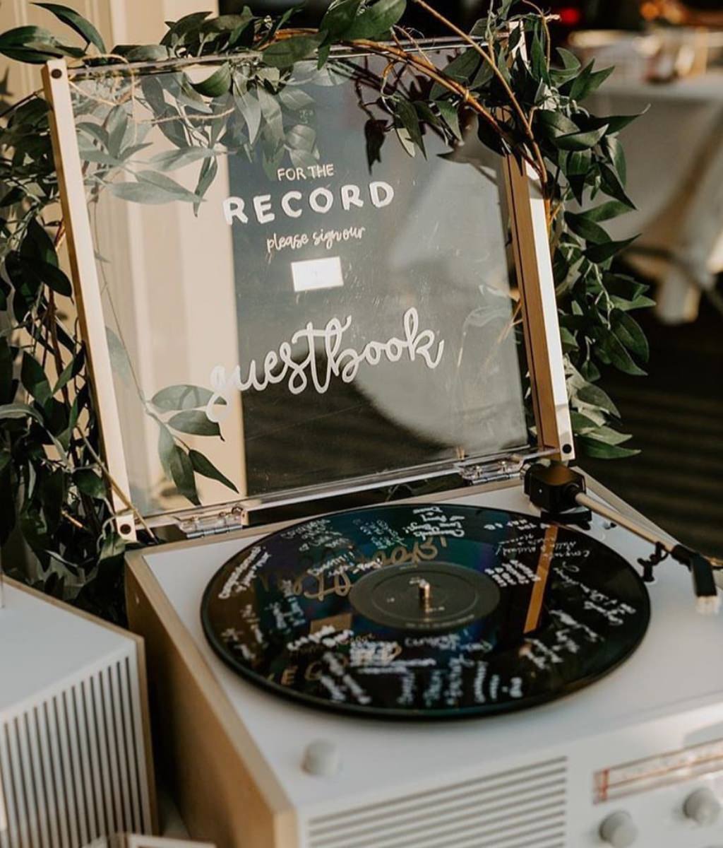 A for the record old vinyl record wedding guest book. such a fun and unique idea